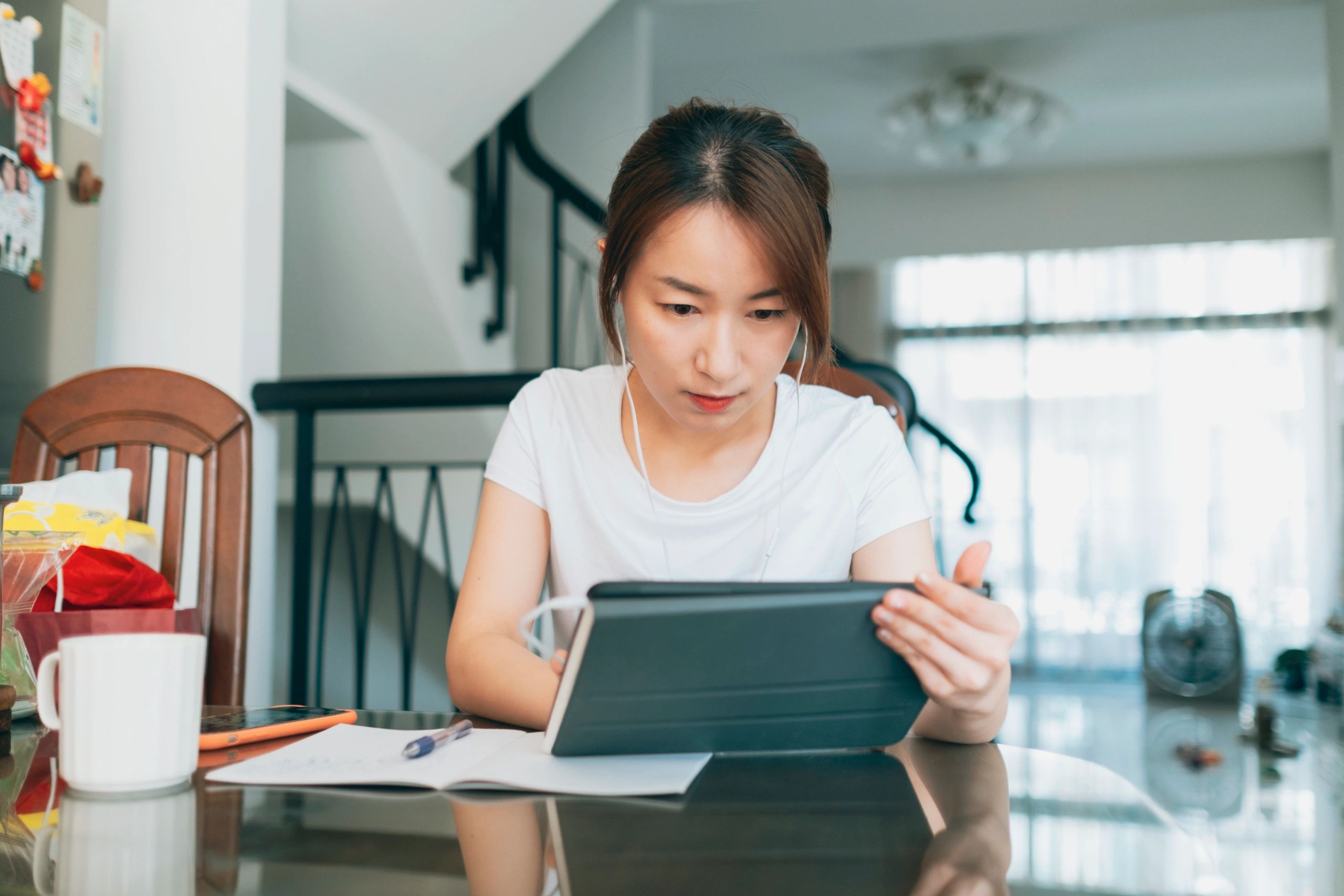 Student studying at home with a laptop